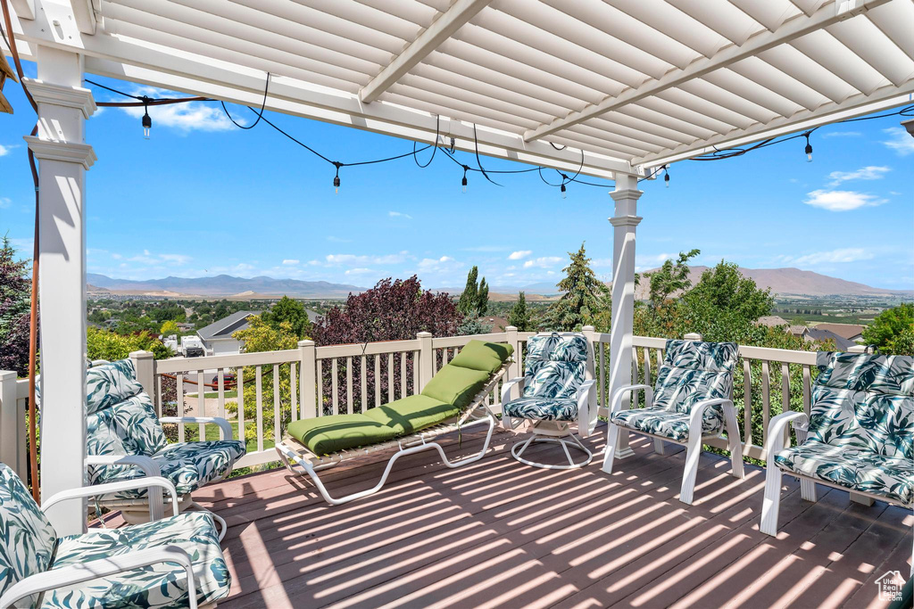 Wooden deck featuring a mountain view