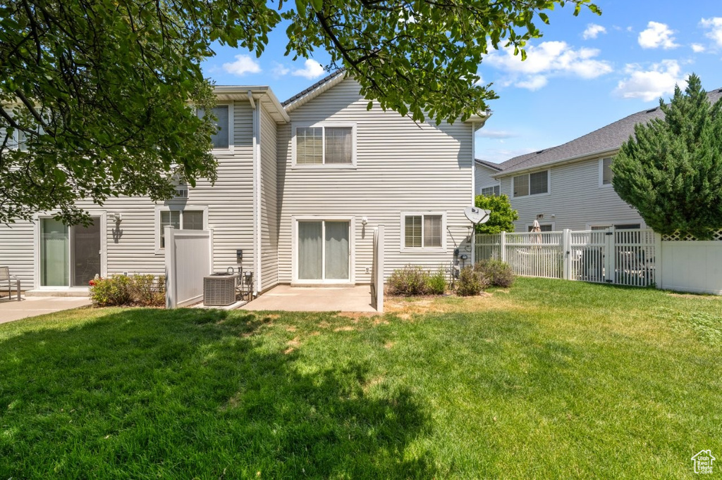 Rear view of property featuring a patio area