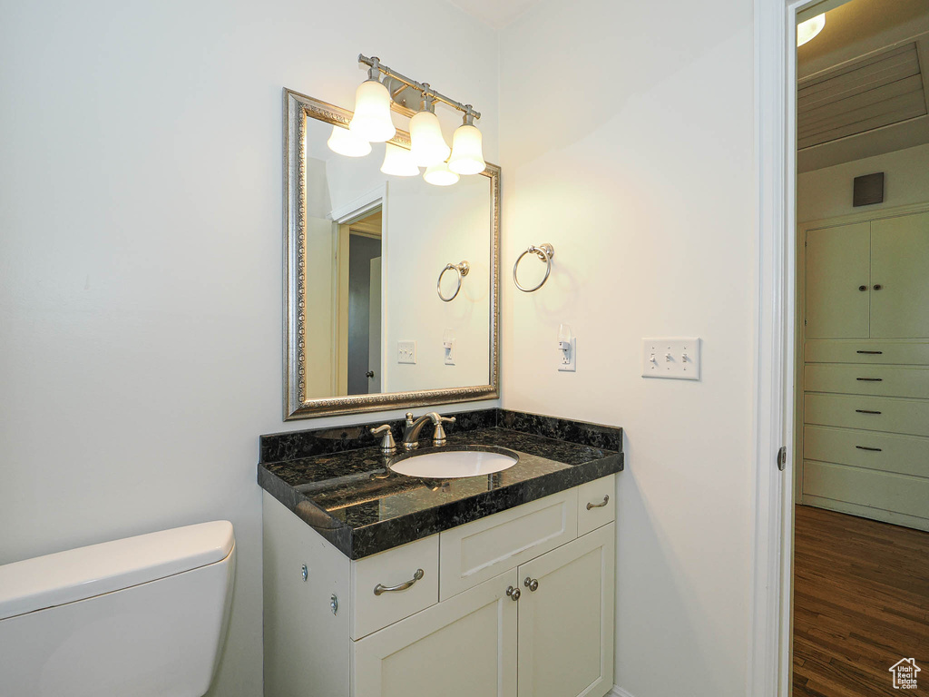 Bathroom featuring vanity and wood finished floors
