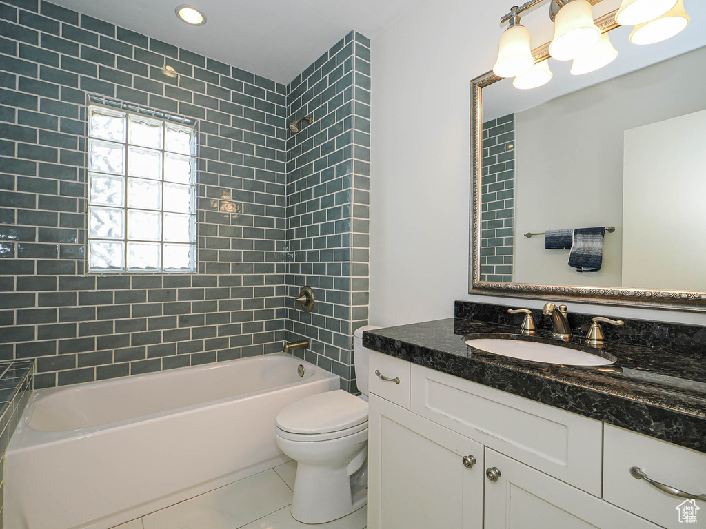 Bathroom with vanity, tile patterned flooring, bathtub / shower combination, and recessed lighting