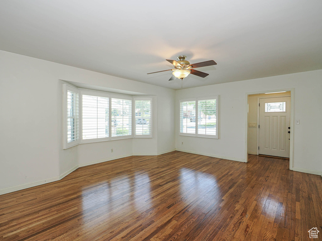 Spare room featuring ceiling fan and wood finished floors