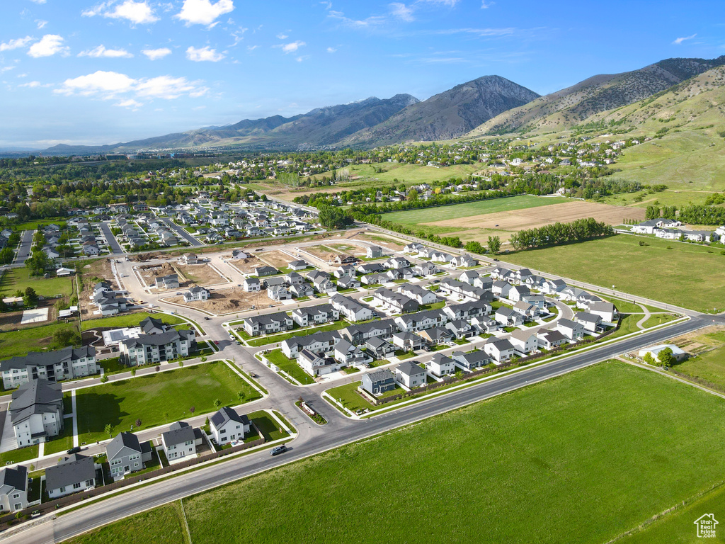 Aerial view of property's location featuring a mountain backdrop