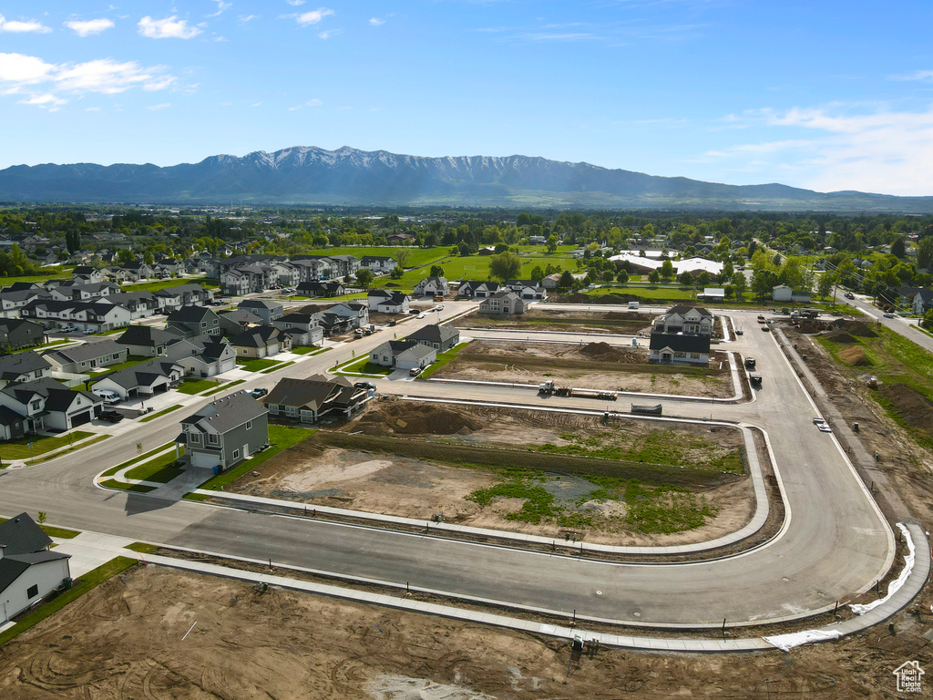 Aerial perspective of suburban area featuring a mountainous background