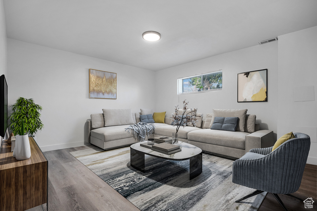 Living area featuring wood finished floors and baseboards