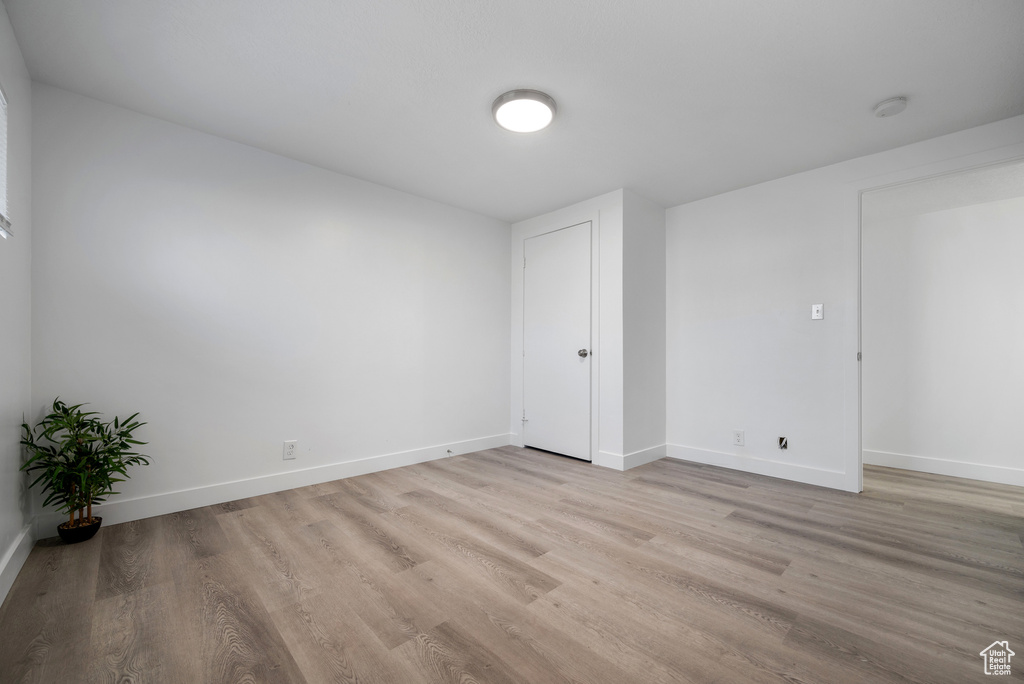 Unfurnished bedroom with light wood-type flooring and baseboards