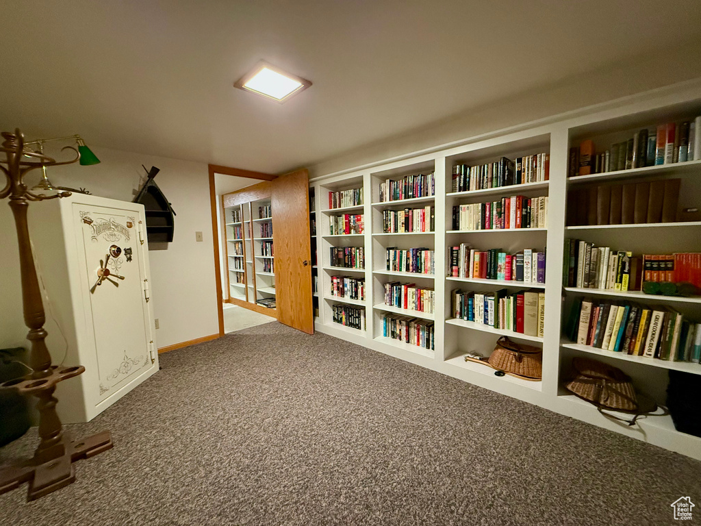 Sitting room with carpet and baseboards