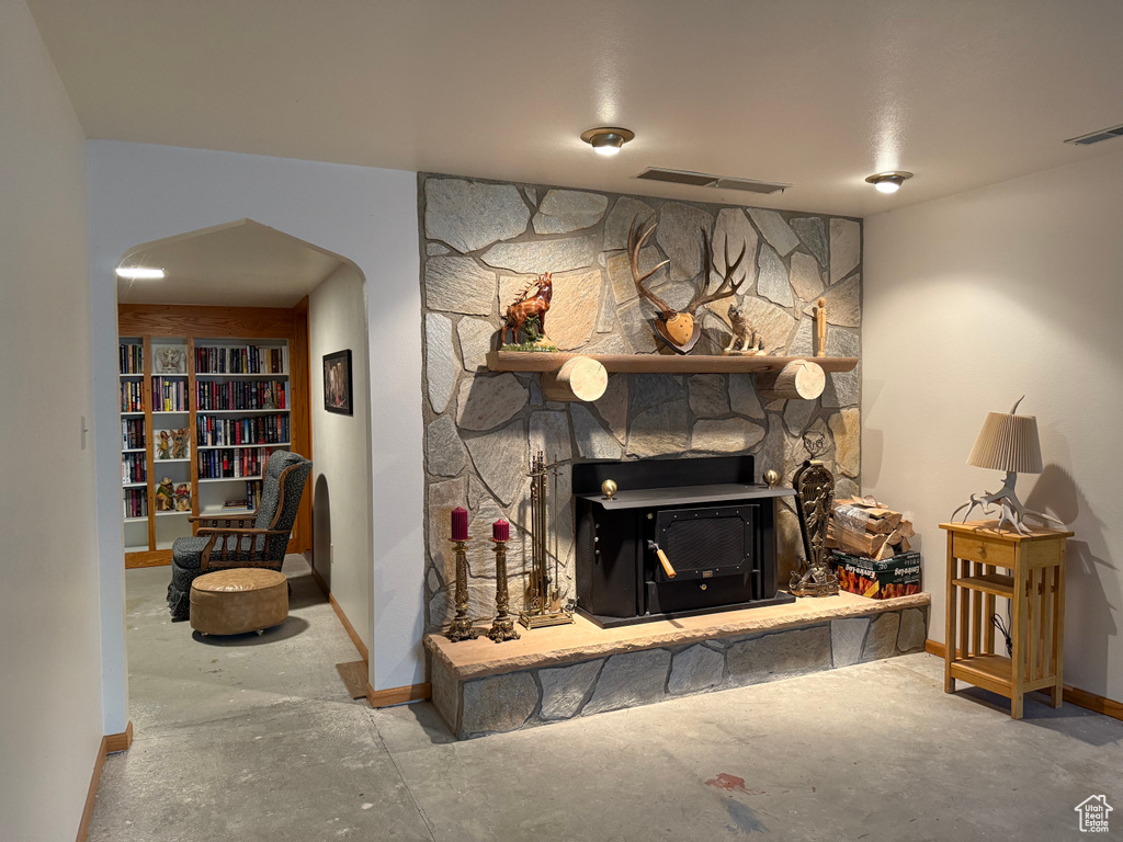 Living room featuring arched walkways and baseboards