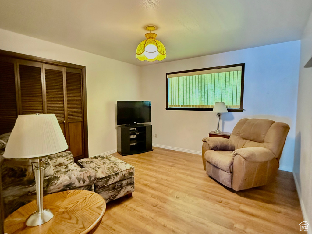 Living area featuring light wood finished floors and baseboards