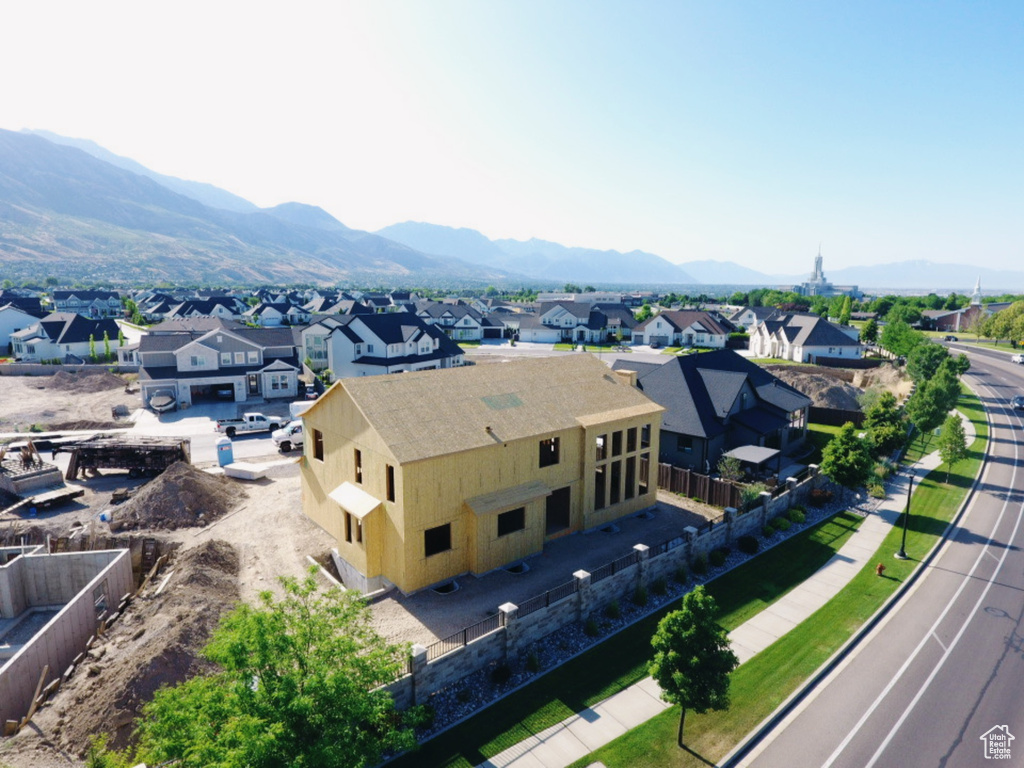 Aerial view of residential area featuring a mountainous background