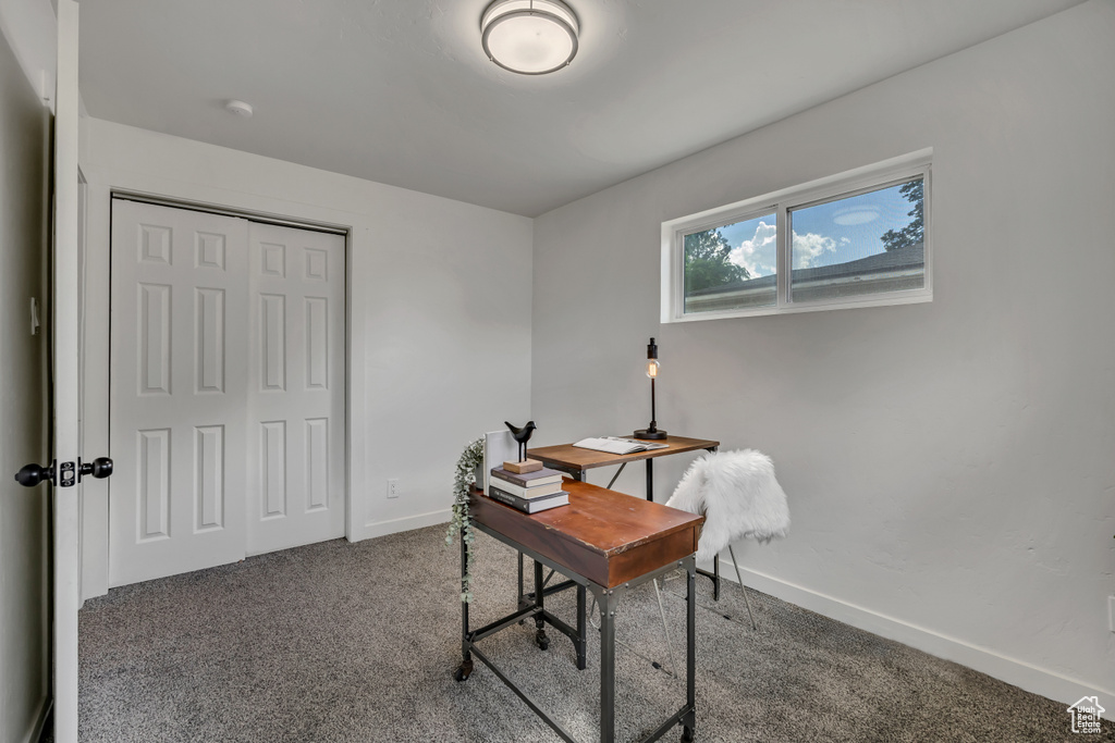 Carpeted office with baseboards