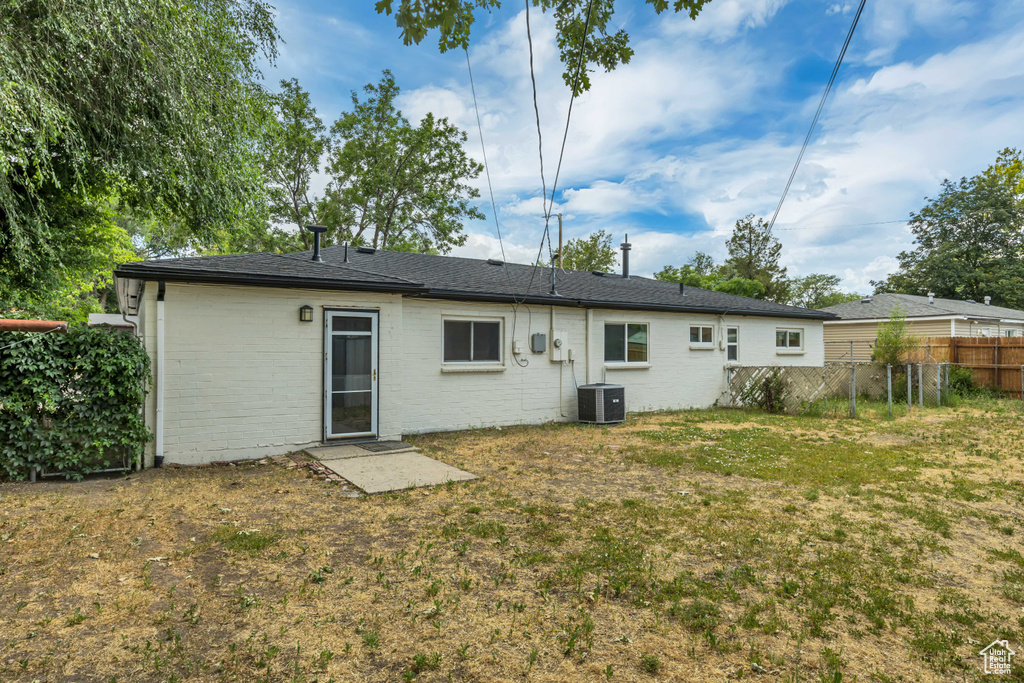 Back of house with brick siding