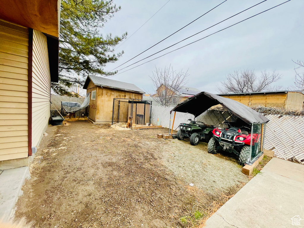 View of home's exterior featuring an outdoor structure