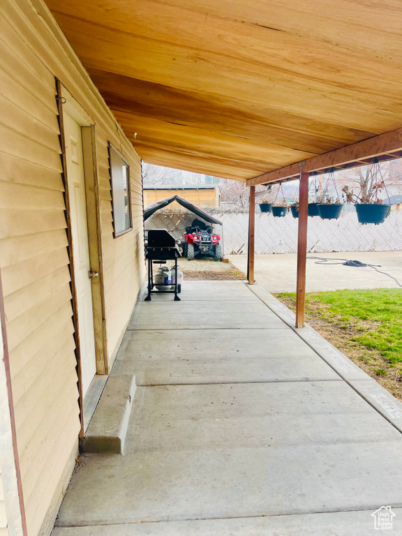 View of patio featuring area for grilling and electric panel