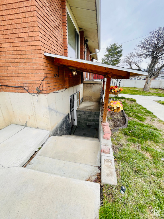 View of side of home featuring brick siding