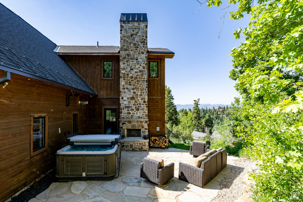 View of patio / terrace featuring a fireplace
