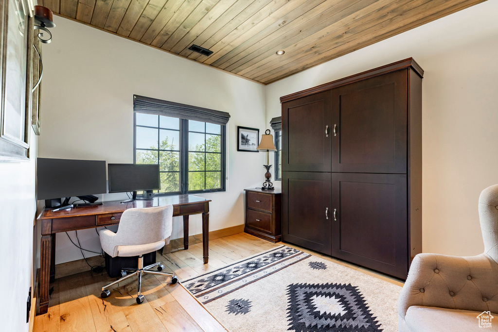 Office area with wooden ceiling and light wood-type flooring