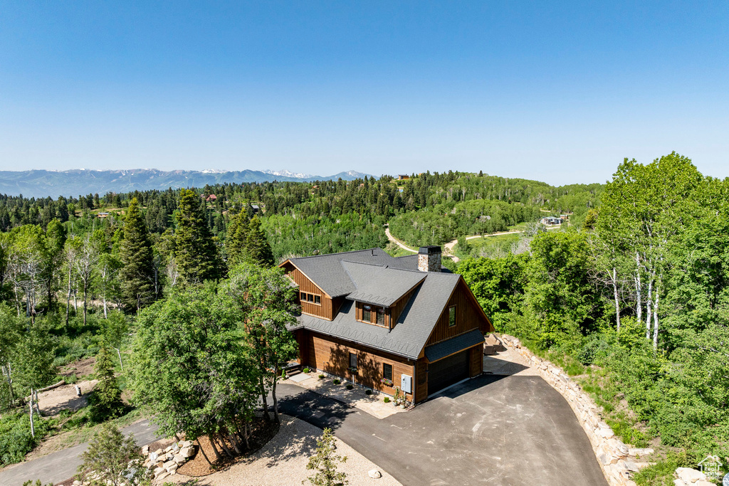 View from above of property with a forest