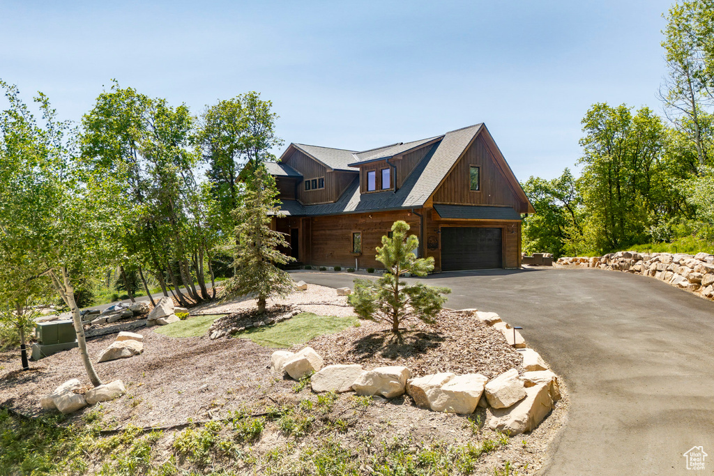 View of front of property featuring driveway and an attached garage