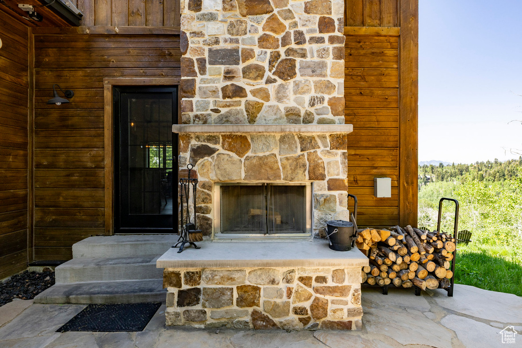 Detailed view of a stone fireplace and stone siding