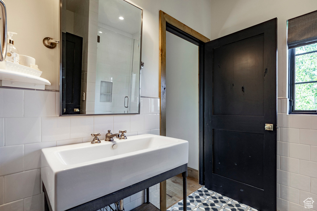 Bathroom featuring wood finished floors and a sink
