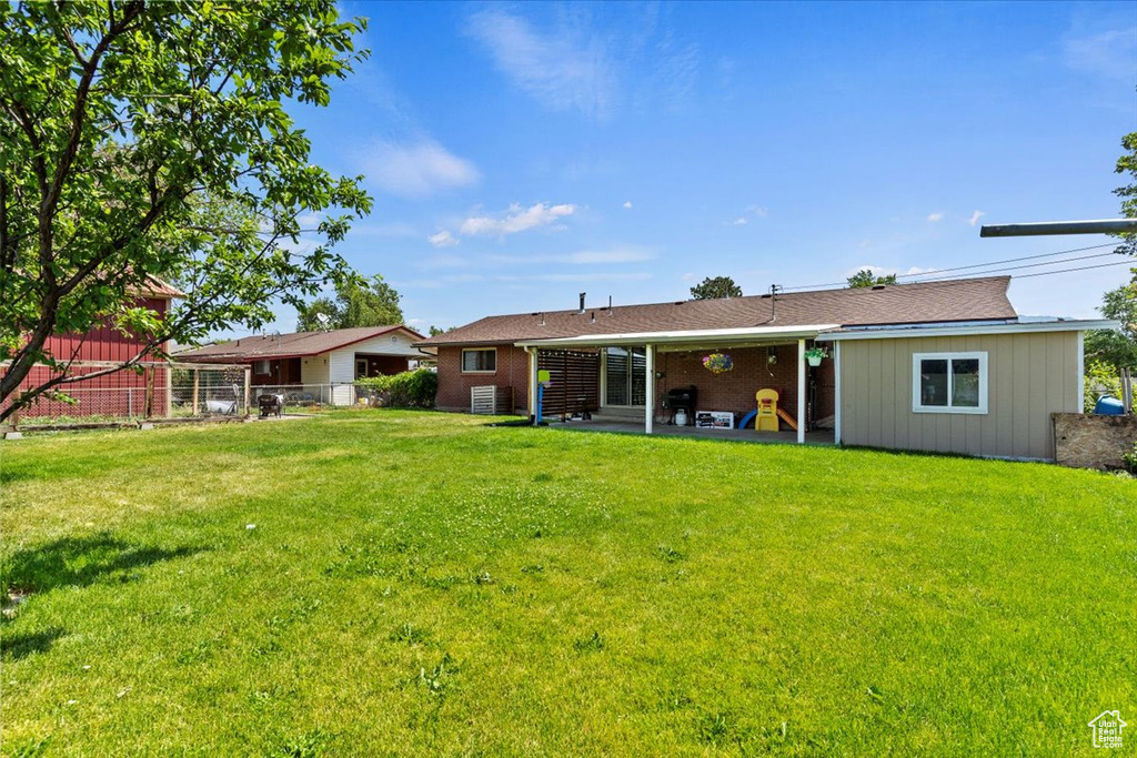 Back of house with a patio