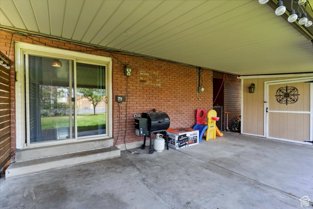 View of patio featuring area for grilling