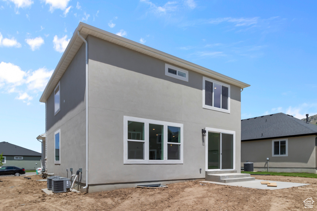 Back of house with stucco siding