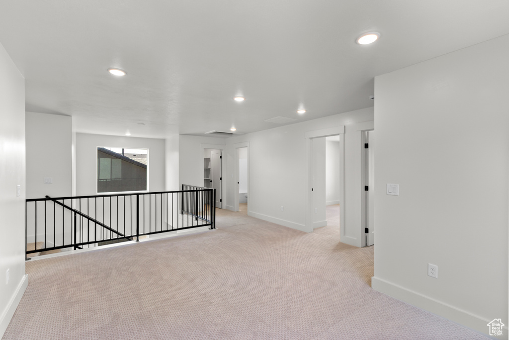 Unfurnished room featuring light colored carpet and recessed lighting