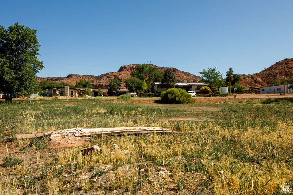 View of mountain backdrop featuring rural landscape
