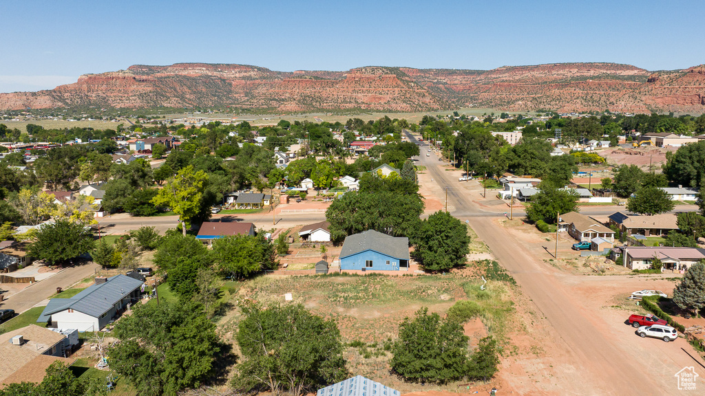 Aerial perspective of suburban area with a mountain backdrop