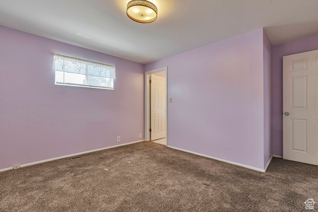 Unfurnished room with carpet floors