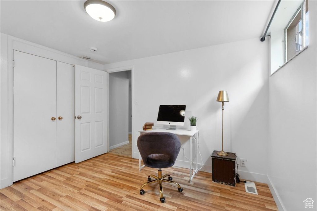 Office with wood finished floors