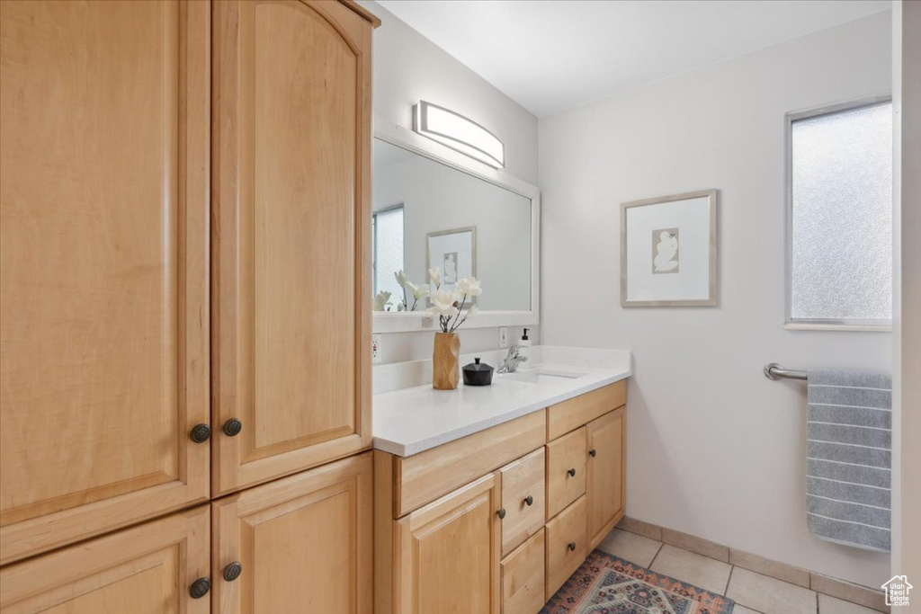 Bathroom with vanity and tile patterned flooring