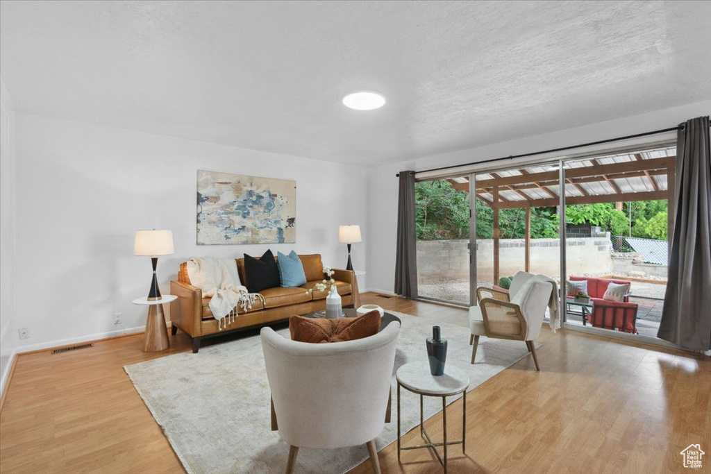 Living area featuring wood finished floors and baseboards