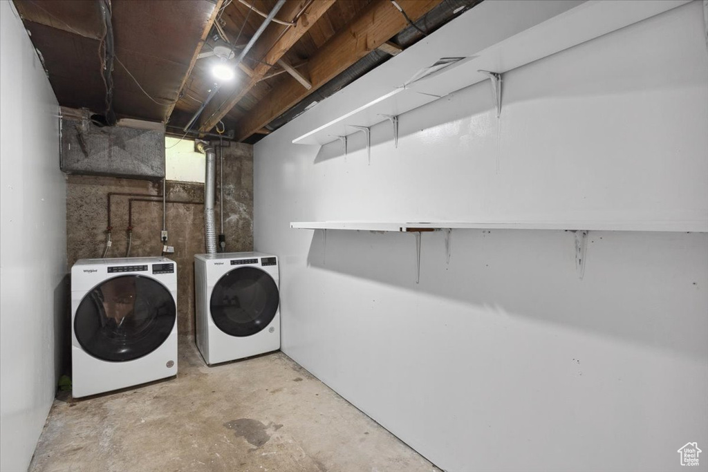 Washroom featuring washer and dryer