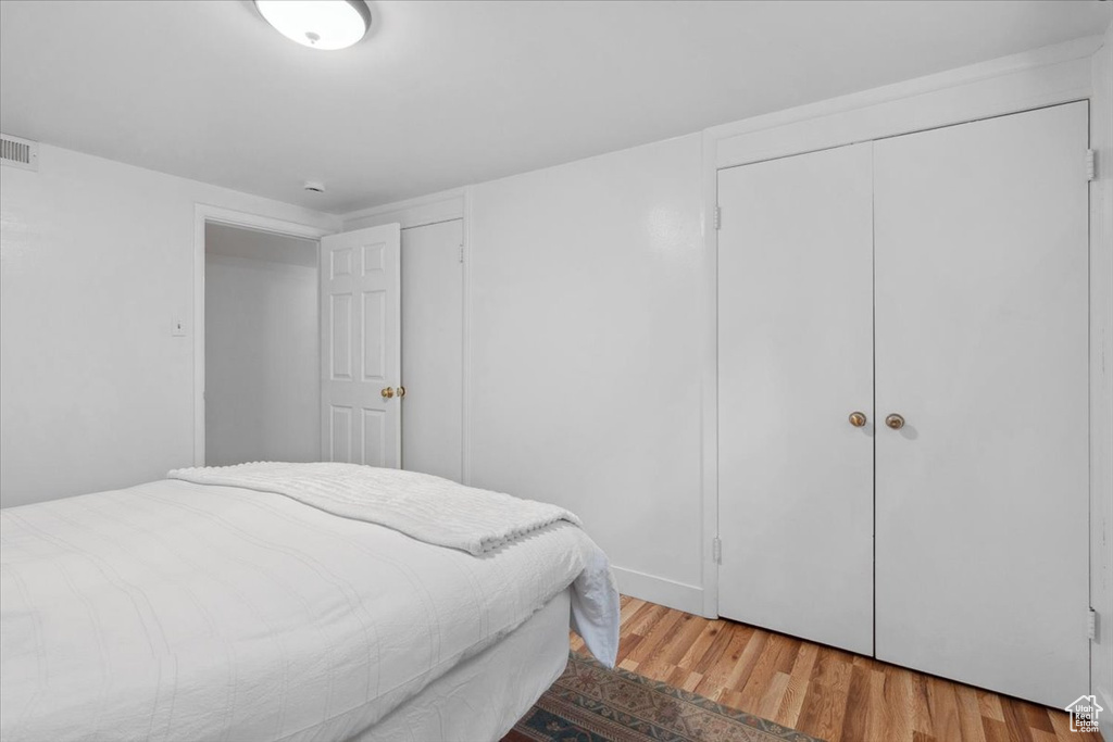 Bedroom with light wood-style floors