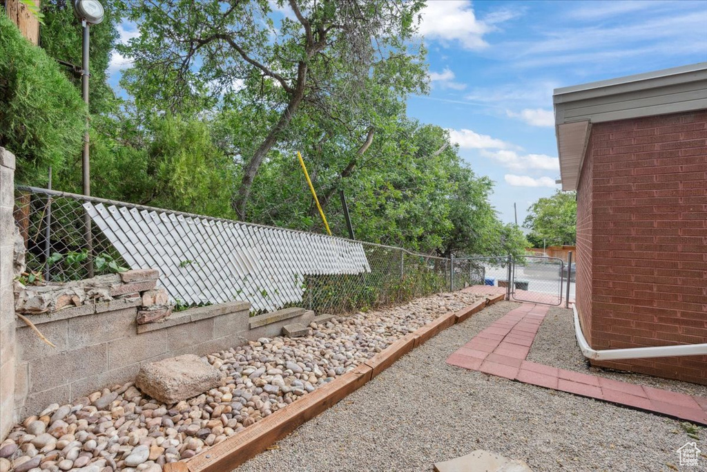 Fenced yard featuring a gate