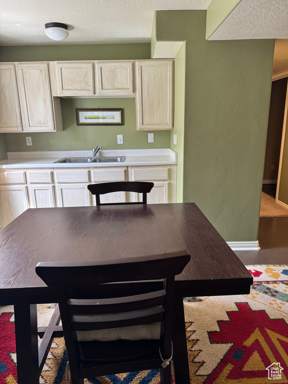 Kitchen featuring a textured ceiling and light countertops