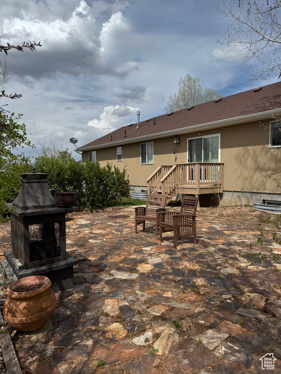 View of patio with a deck