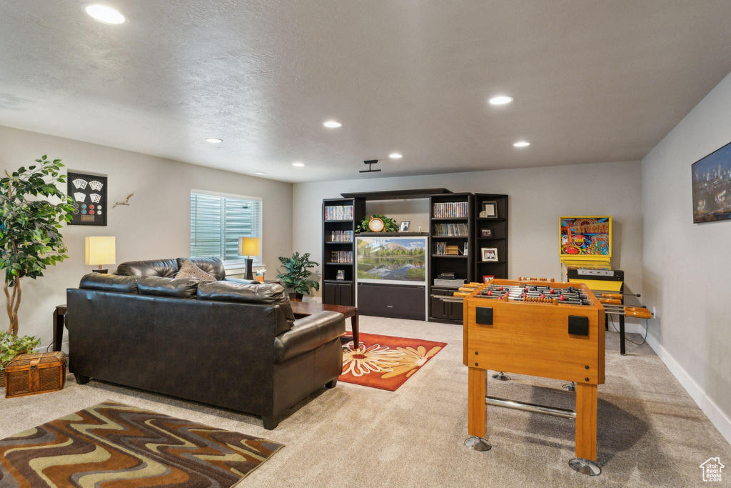 Playroom featuring light colored carpet, recessed lighting, and baseboards