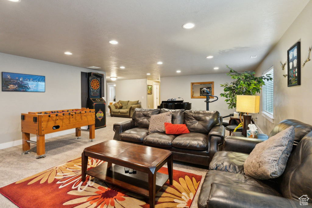 Living area featuring recessed lighting, carpet floors, and baseboards