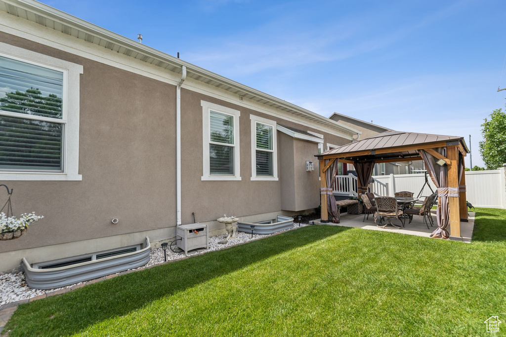 View of yard with a gazebo and a patio area
