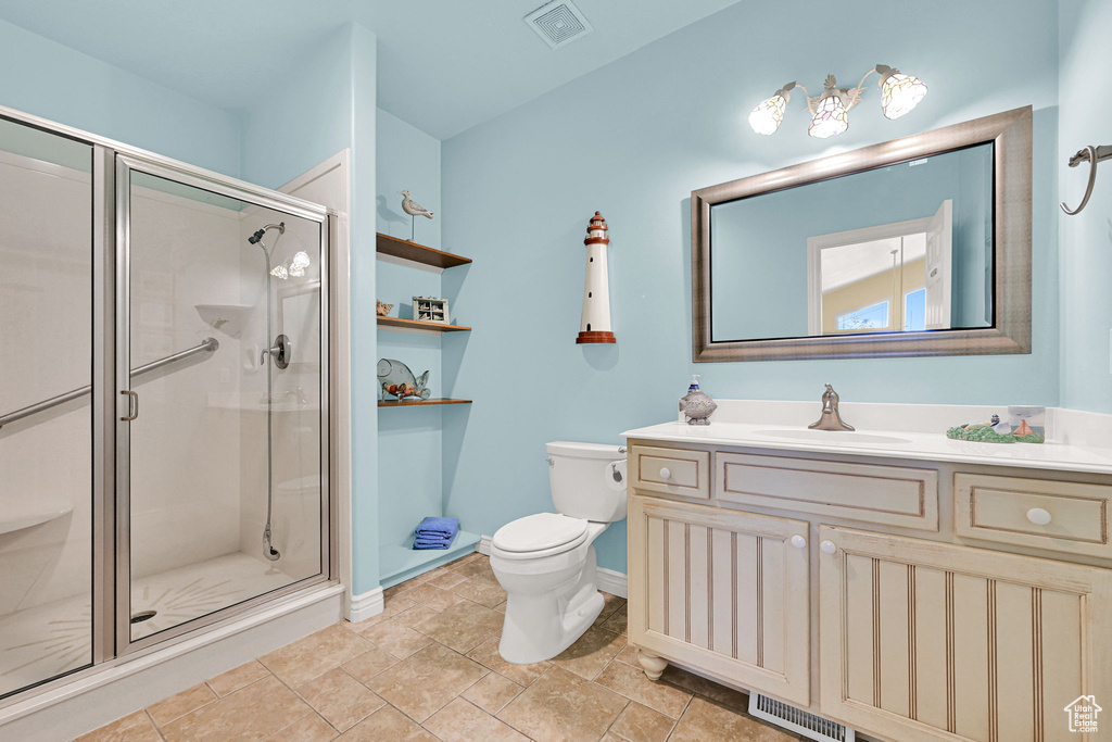 Full bath with vanity and a stall shower