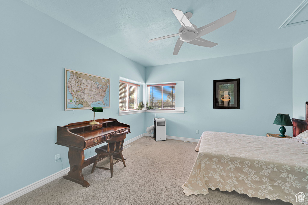 Bedroom with carpet flooring and ceiling fan