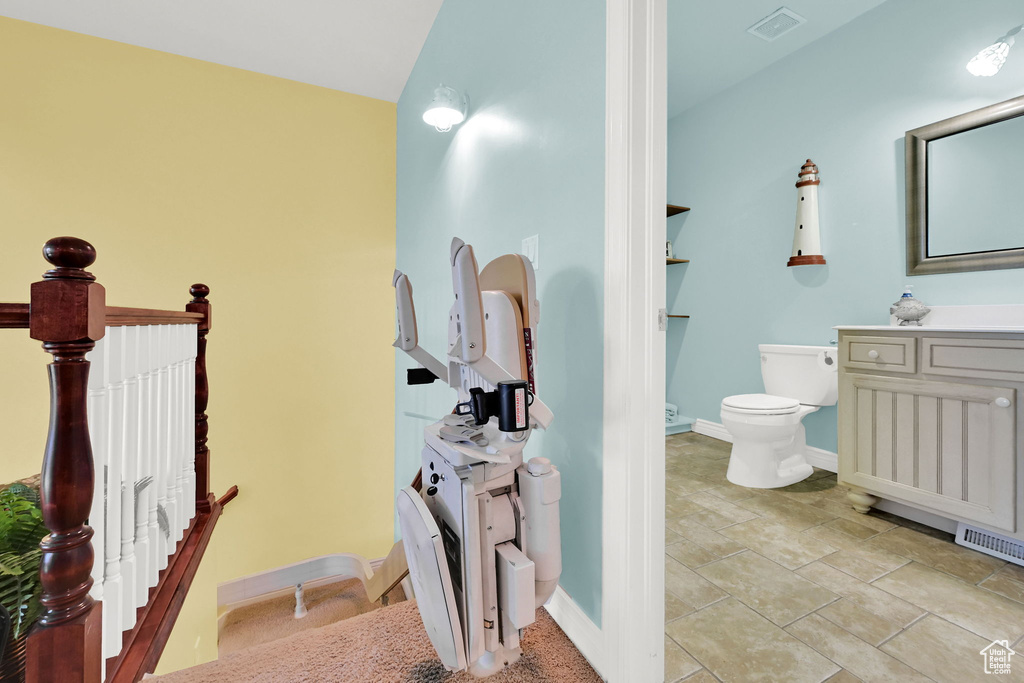 Bathroom featuring toilet and vanity