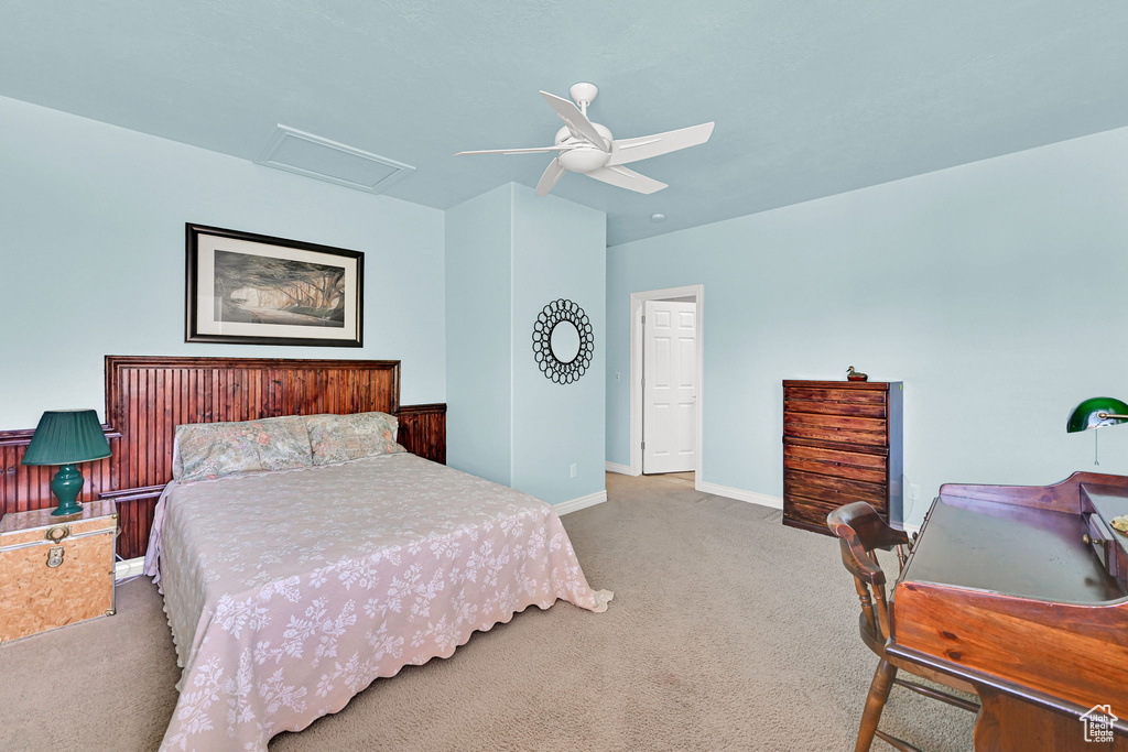 Bedroom featuring carpet flooring, attic access, and ceiling fan