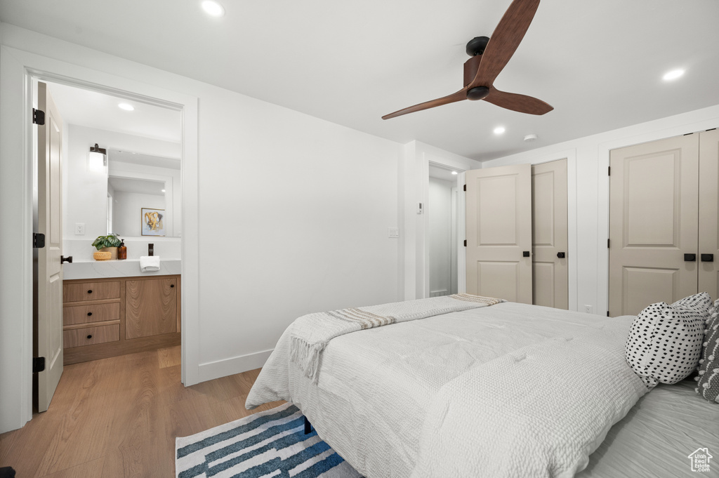 Bedroom featuring recessed lighting, light wood-style floors, a ceiling fan, and ensuite bath