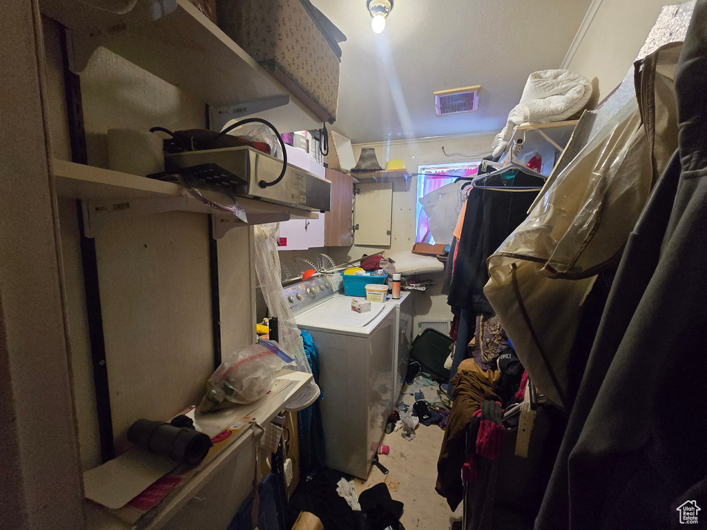 Laundry area with cabinet space and washing machine and dryer