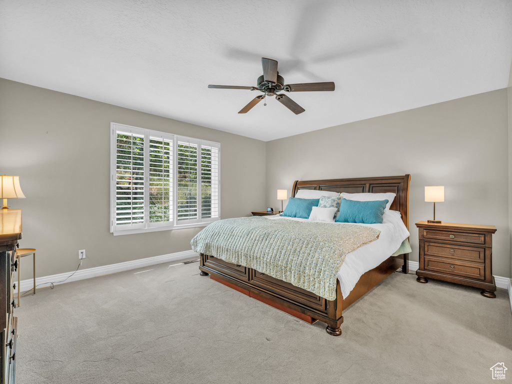 Bedroom with carpet and a ceiling fan