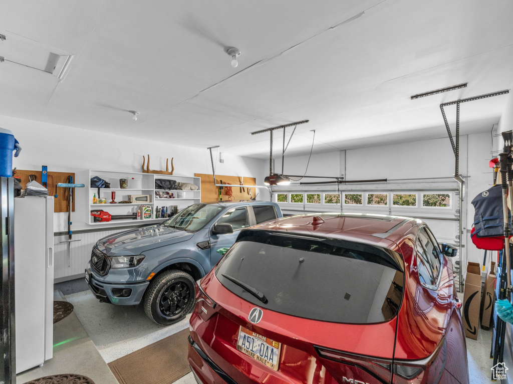 Garage featuring a garage door opener